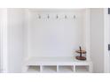 Bright mudroom features hooks, shelving, and shoe storage for organization and convenience at 595 E Cabarrus St, Raleigh, NC 27601