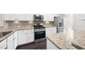 Well-equipped kitchen features stainless steel appliances and granite countertops, ideal for cooking and entertaining at 684 Wickham Ridge Rd, Apex, NC 27539