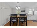 An inviting dining area featuring a classic table and chairs under a chandelier at 808 Ravenwood Dr, Raleigh, NC 27606