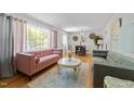 Stylish living room with hardwood flooring and backyard view at 808 Ravenwood Dr, Raleigh, NC 27606