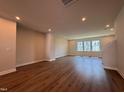 Spacious living room with recessed lighting, hardwood floors and ample natural light at 809 Hyperion Aly, Wake Forest, NC 27587