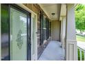 Covered front porch showcasing decorative glass front door, stone accents, and classic design at 112 Briarfield Dr, Apex, NC 27502
