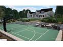 Recreation and lounge area with a full-size basketball court and an outdoor seating area perfect for entertaining at 1132 Wimbleton Dr, Raleigh, NC 27609