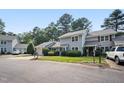Inviting townhome with a charming facade, featuring an attached garage and a well-kept lawn at 1600 Budwood Dr, Raleigh, NC 27609