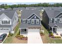 Beautiful new construction home in a desirable neighborhood with well-manicured lawns at 1725 Winter Jasmine Ln, Wake Forest, NC 27587