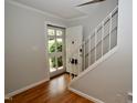 Inviting foyer featuring pristine hardwood floors, stairway, and a bright, freshly painted interior at 1908 Smallwood Dr, Raleigh, NC 27605