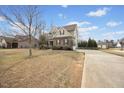 Charming two-story home with a combination of stone and siding, complemented by a well-manicured lawn and inviting curb appeal at 224 Swann Trl, Clayton, NC 27527