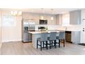 Modern kitchen with stainless steel appliances, quartz countertops, and island seating at 250 Patterson Dr, Roxboro, NC 27573