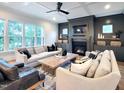 Cozy living room featuring a fireplace, plush seating, and stylish decor for a comfortable atmosphere at 3160 Mantle Ridge Dr, Apex, NC 27502
