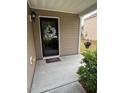 Inviting covered porch with decorative wreath, perfect for greeting guests at 3515 Mountain Brook Cir, Durham, NC 27704