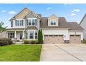 Charming two-story home showcasing a three-car garage and a lush green lawn at 44 Good Morning Ln, Garner, NC 27529