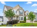 Two-story home with a three-car garage and a well-maintained lawn and landscaping at 44 Good Morning Ln, Garner, NC 27529