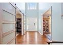Bright foyer with hardwood floors, high ceilings, and stylish sliding barn doors at 947 Middle Ground Ave, Rolesville, NC 27571