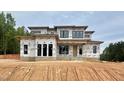 Modern two-story home featuring a contemporary design with large windows and unique architectural elements at 10 Gambel Dr, Youngsville, NC 27596