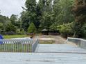 Spacious backyard featuring a gazebo and framed by a brick wall at 1208 Hatch Rd, Chapel Hill, NC 27516