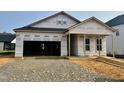 Image of a newly constructed home with open garage showing framing and foundation at 139 W Crescent Mills Blvd # Homesite 235, Wilson's Mills, NC 27520