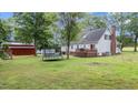 Spacious backyard featuring a deck, storage shed, and ample room for outdoor activities at 1401 Berea Rd, Rougemont, NC 27572