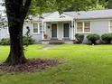 Charming duplex with well-maintained lawn and landscaping offers great curb appeal and comfortable living at 1500 Brent Ct # 9B, Burlington, NC 27215