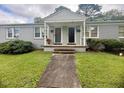 The building has a well-manicured lawn and flowers at 1500 Brent Ct # 9B, Burlington, NC 27215