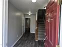 Home foyer with stairs and hardwood floors at 1527 Haywards Heath Ln, Apex, NC 27502