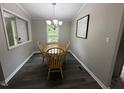 Charming dining room with classic decor, natural light, and comfortable seating at 195 Windsong Ln, Youngsville, NC 27596