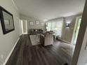 Cozy living room with hardwood floors, a large window, and comfortable seating at 195 Windsong Ln, Youngsville, NC 27596