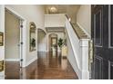 Elegant foyer with hardwood floors, staircase, soaring ceilings, and stylish decor at 347 Country Mill Way, Fuquay Varina, NC 27526