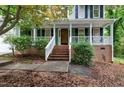 Welcoming front porch with brick steps and white railings, perfect for relaxing at 3511 Shady Creek Dr, Durham, NC 27713