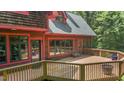 Gorgeous wood home with expansive windows and a large deck that enhances the appeal of outdoor living at 4110 Stoneycreek Rd, Chapel Hill, NC 27514