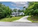 Beautiful home with an eye-catching front porch and a long driveway at 180 Normandy Rd, Louisburg, NC 27549