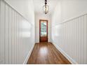 Inviting entryway with beautiful hardwood floors and wainscoting at 245 Tumbling River Dr, Wendell, NC 27591