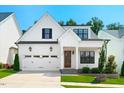 Beautiful two-story home with a well-maintained front yard and a two-car garage at 245 Tumbling River Dr, Wendell, NC 27591