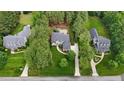 An aerial view showcases a landscaped property with a sprawling lawn and mature trees at 3004 Krogen Ct, Creedmoor, NC 27522