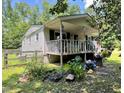Inviting one-story home with a covered porch, offering a relaxing outdoor space at 4601 Orange Grove Rd, Hillsborough, NC 27278
