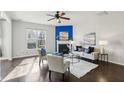 Sunlit living room features a fireplace and hardwood flooring at 8204 Yaxley Hall Dr, Raleigh, NC 27616