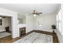 Bright living room featuring hardwood floors, fireplace, and white wood ceiling at 931 Eastern Ave, Nashville, NC 27856