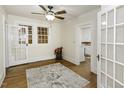 Bright living room showcasing hardwood floors, white walls, and ceiling fan at 931 Eastern Ave, Nashville, NC 27856