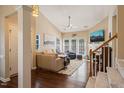 Inviting living room with vaulted ceiling, fireplace, and a staircase at 1 Lake Hill Dr, Durham, NC 27713