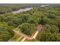 Beautiful aerial view of wooded property with lake access at 114 Crow Dr, Louisburg, NC 27549