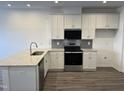 Bright kitchen with stainless steel appliances, granite countertops and classic white cabinets at 1945 Plott Balsam Dr, Wendell, NC 27591