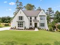 Charming two-story home with manicured lawn, beautiful landscaping, and inviting curb appeal at 217 Dublin Rd, Raleigh, NC 27609