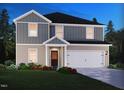 Charming two-story home with gray and beige vinyl siding, an inviting front porch, and green lawn at 2254 Cherry Creek Rd, Haw River, NC 27258
