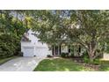 Charming two-story home featuring a two-car garage, neutral siding, and well-maintained front lawn at 4213 Stoneford Trace Dr, Raleigh, NC 27616