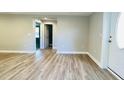 View of bright living room showcasing adjacent doors and modern light gray walls at 505 E Canary St, Dunn, NC 28334