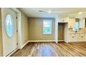 Bright living room showcasing a modern design with adjacent kitchen and natural light at 505 E Canary St, Dunn, NC 28334
