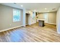 Spacious, open floorplan with modern light gray walls and beautiful vinyl flooring throughout at 505 E Canary St, Dunn, NC 28334