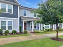 Attractive townhome showcases two-story architecture, manicured lawns, and mature trees at 6536 Perry Creek Rd, Raleigh, NC 27616