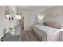 Cozy bedroom with soft pink accents, plush carpet, and ample natural light, creating a serene space at 693 White Birch Ln, Angier, NC 27501