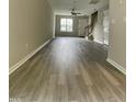 Spacious living area showcasing modern flooring, neutral walls, and staircase at 7832 Averette Field Dr, Raleigh, NC 27616