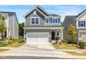 Charming two-story home with a well-manicured front yard and two car garage at 1007 Sora Way, Durham, NC 27703